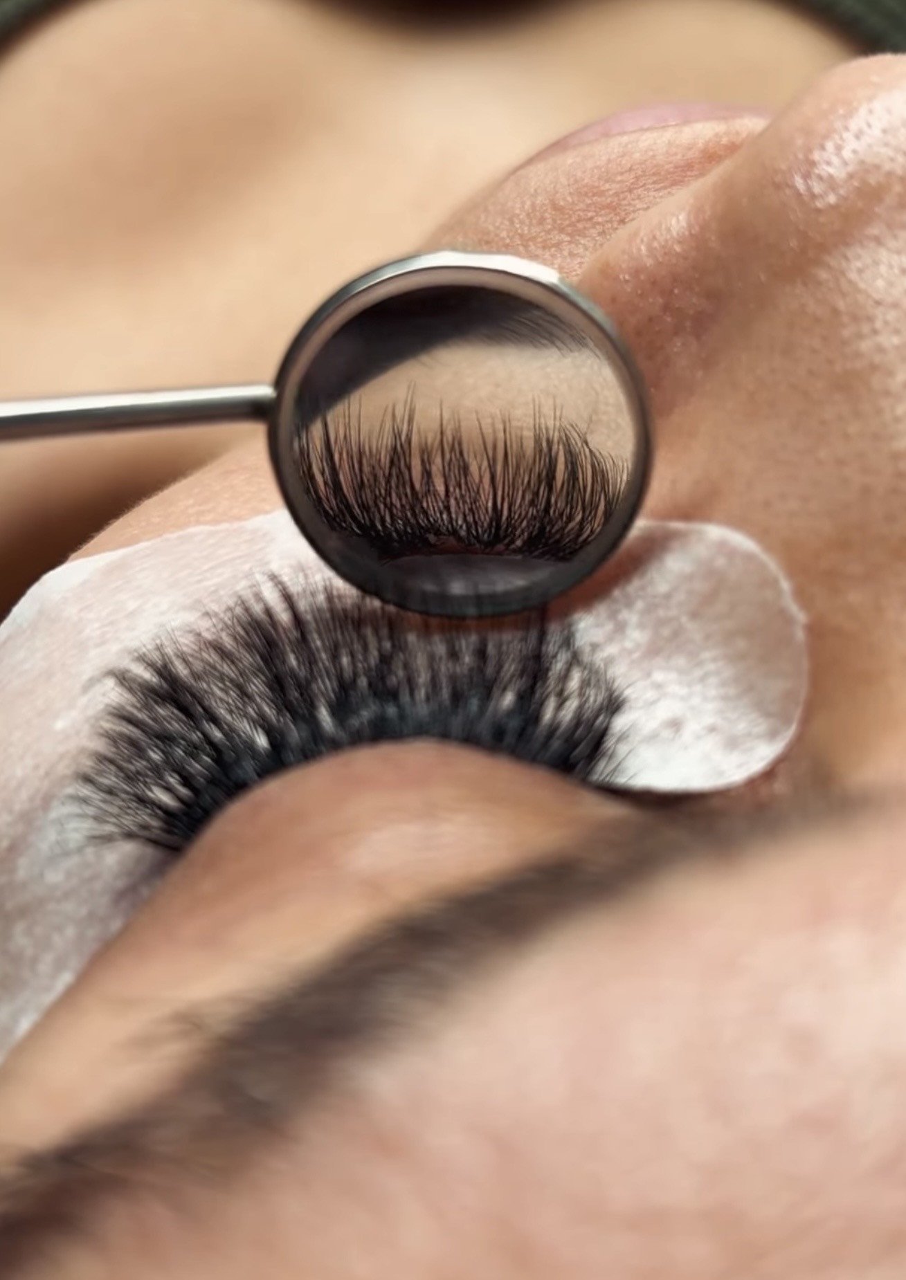 Lash extension close-up with mirror tool